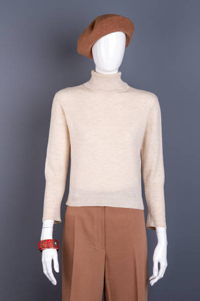istock White sweater and brown trousers on mannequin. 917675456