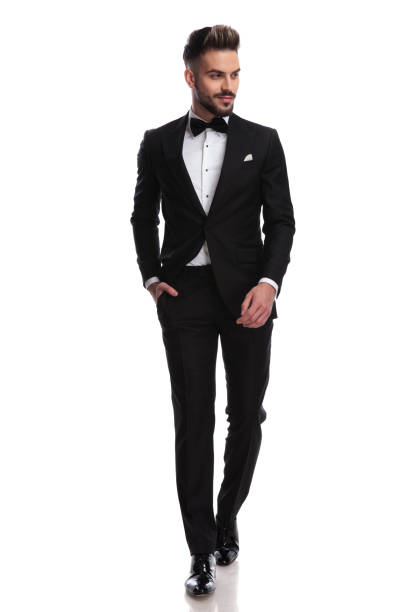 istock smiling young elegant man is walking and looks to side 917676396