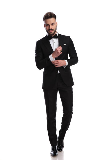 istock modern gentleman fixing his cufflinks 917677150