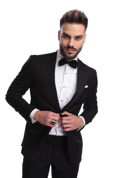 istock cool modern man in tuxedo holds button 917677862