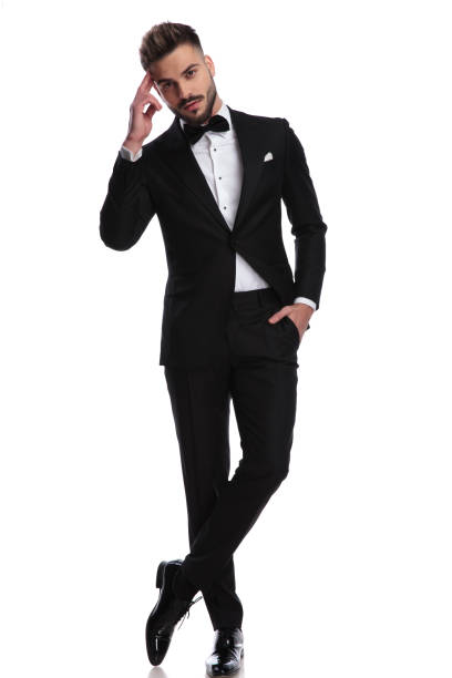 istock elegnat man in tuxedo making a military salute 917682996