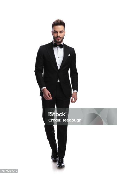 Happy Young Male Fashion Model In Tuxedo Is Walking Stock Photo - Download Image Now