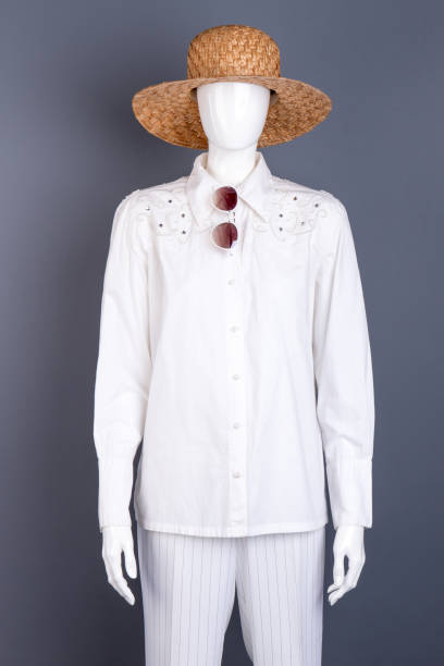 istock Mannequin dressed in straw hat and blouse. 917685118