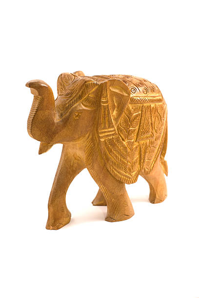 istock Wooden elephant sculpture isolated on white 91768935