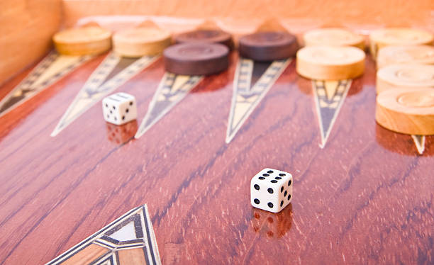 istock Ivory dices on wooden handmade backgammon board isolated 91768981