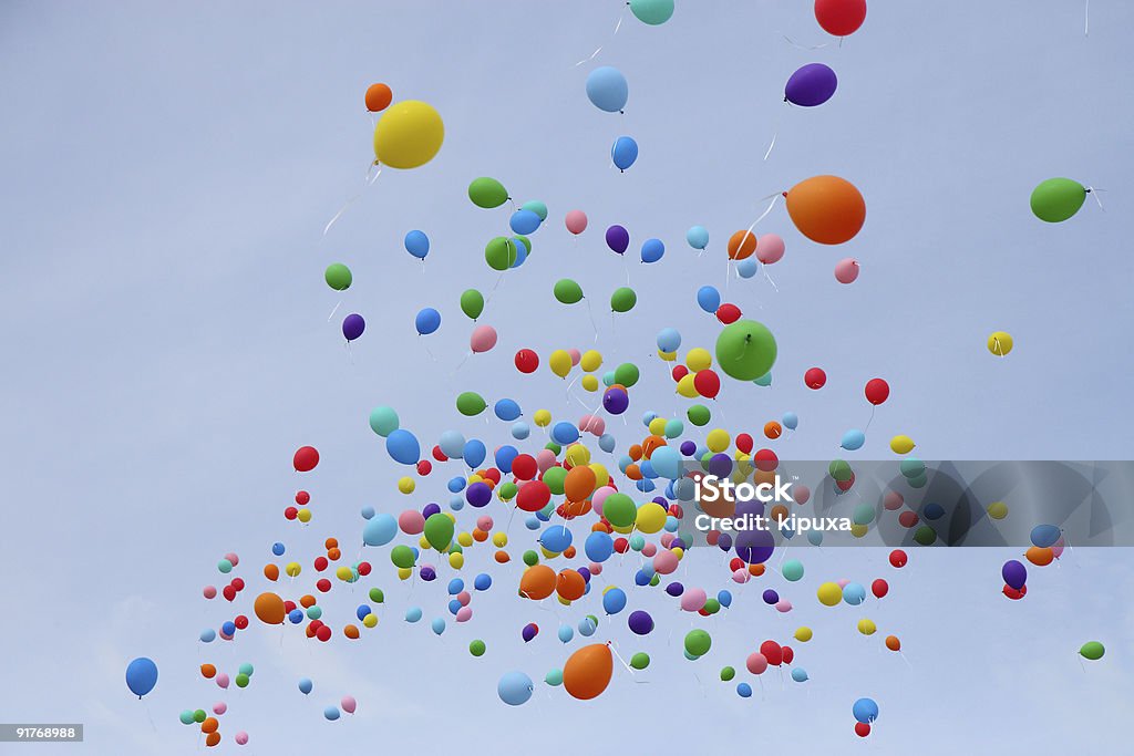 Many colored balloons fly into sky Bunch of helium balloons in the sky Balloon Stock Photo