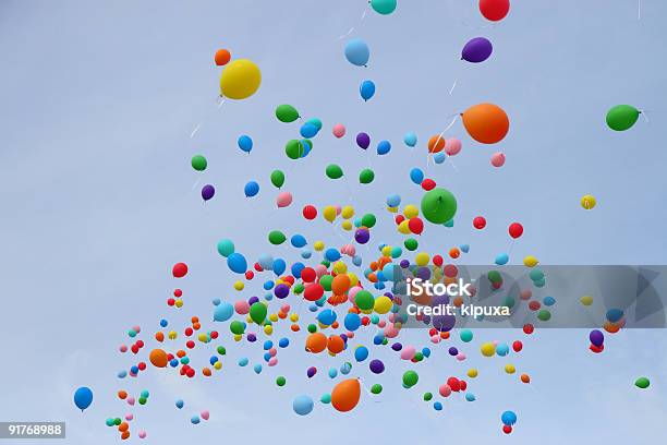 Many Colored Balloons Fly Into Sky Stock Photo - Download Image Now - Balloon, Releasing, Sky