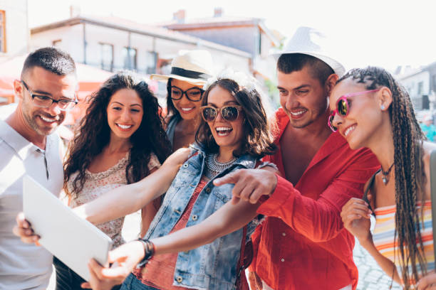istock Group of young people taking selfie with tablet 917691656