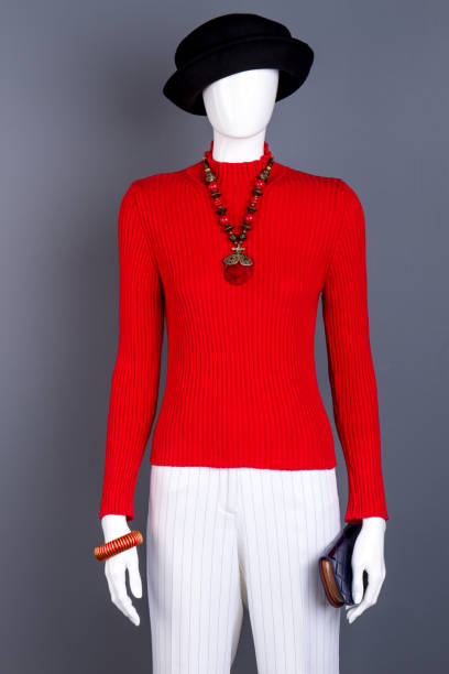 istock Mannequin in black hat and red sweater. 917692626