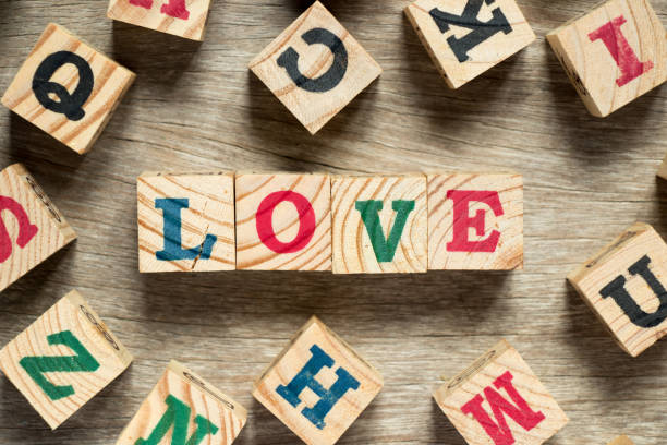 istock Letter block in word love with another on wood background 917695412