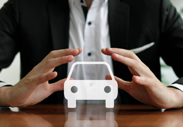 istock Businessman protecting car with hands 917696224