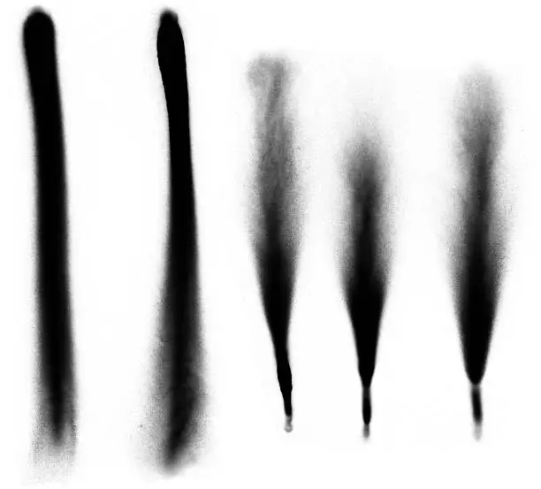 A group of spray paint flares on a white background.