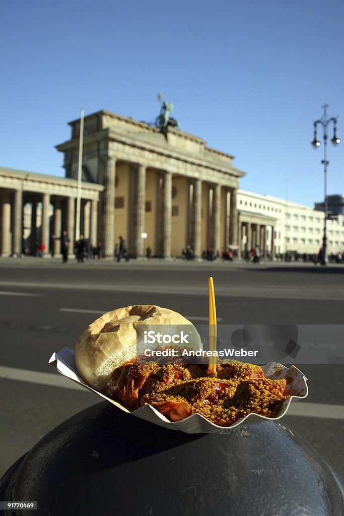 Berlin Currywurst and Brandenburg Gate - two German landmarks  Curry Sausage Stock Photo