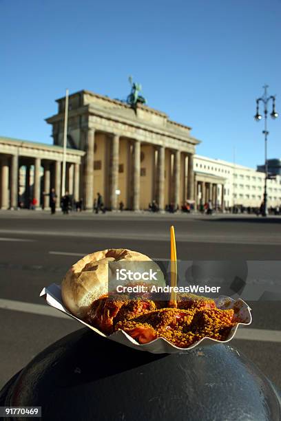 Berlin Currywurst And Brandenburg Gate Two German Landmarks Stock Photo - Download Image Now