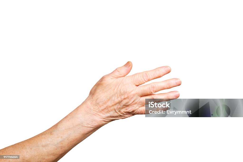 Senior female gesture language, hands signs isolated on solid white background. Old female in her seventies / eighties showing arms forearms. Elderly woman, wrinkled hand palm w/ clearly visible veins reaching out forward. Old lady arms, freckles. Isolated white background, close up, overhead, copy space. Hand Stock Photo