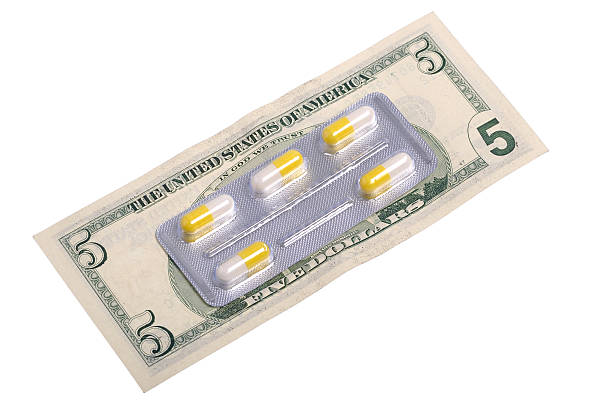 Pills and money stock photo