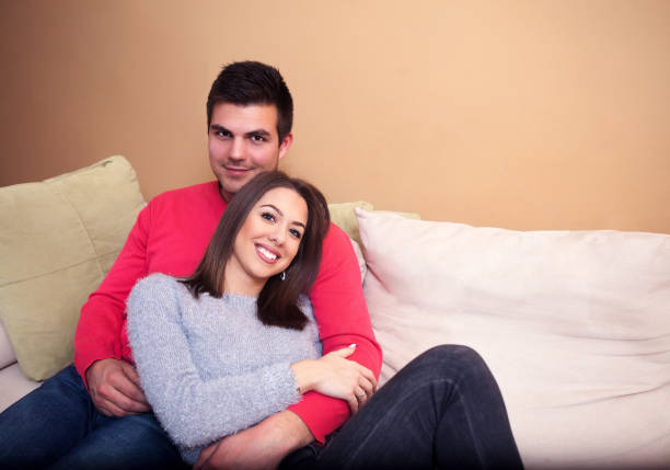 istock Young beautiful couple in home interior 917710980