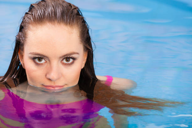 istock Woman having fun in swimming pool 917711266