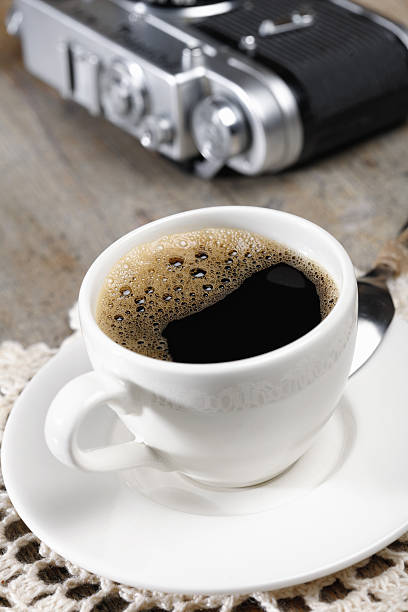 istock espresso coffee and old retro camera on background 91771309
