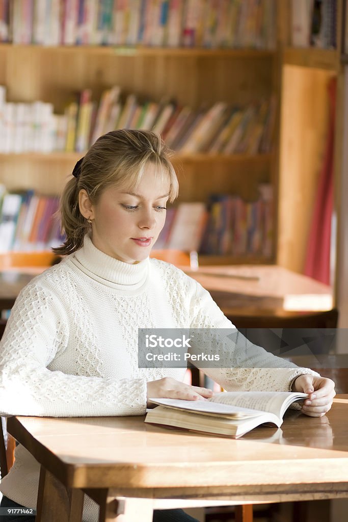 student girl in library one  Adult Stock Photo