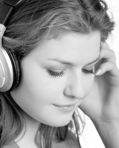istock listens to music with headphones 91771493