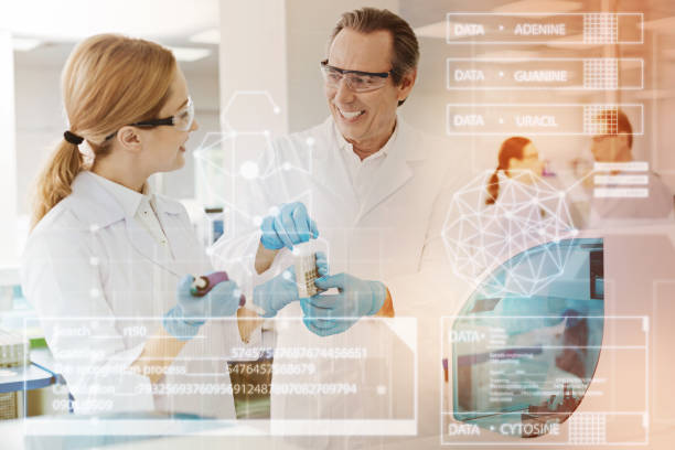 istock Cheerful doctor smiling to his colleague while working with her 917714972