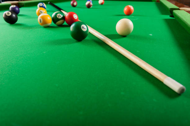 istock Snooker ball and stick on billiard table 917717148
