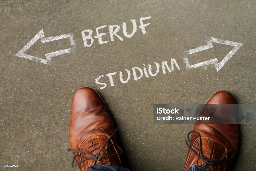Decision time: job or university? (in German: Beruf / Studium) Young adult has to decide between university and job Adults Only Stock Photo