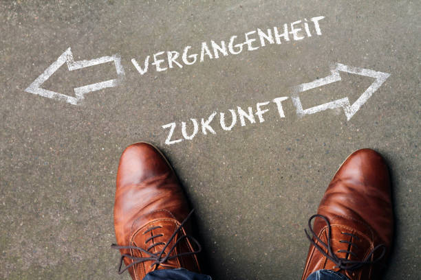 Between Past and Future (German: Vergangenheit / Zukunft) Man in brown leather shoes between Past and Future zukunft stock pictures, royalty-free photos & images