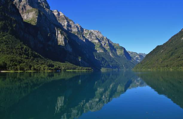 istock Glarnisch, mountain range in Glarus canton reflecting in lake Klontalersee. Quiet summer day in Switzerland. 917723172