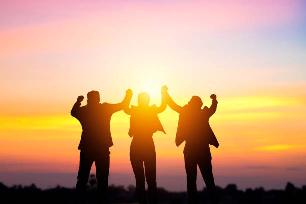 istock Team work and succes concept, silhouette business people corporate and win 917733620