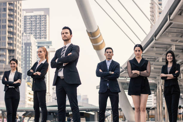 istock Teamwork and professional partnership concept, businesspeople team of multi ethnic standing with confidence in full suit 917733630