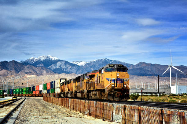 Palm Springs, California, USA - January 14, 2018:  Overseas Freight containers being transported on a Union Pacific Railroad train passing nearby Palm Springs, Coachella Valley, Western USA.