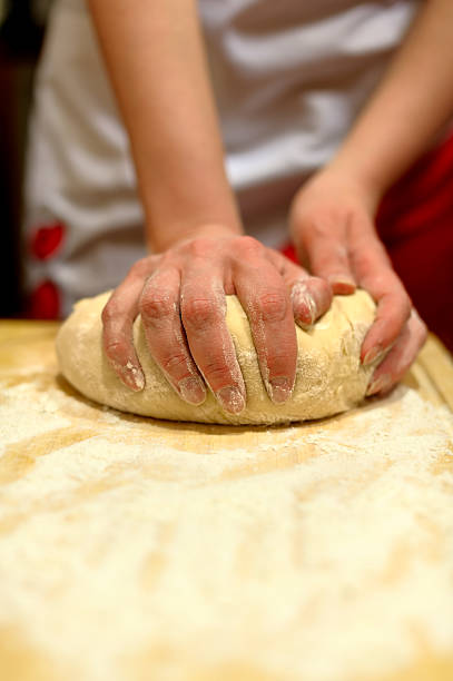 istock A pair of hands kneading a mass of bread dough 91773405