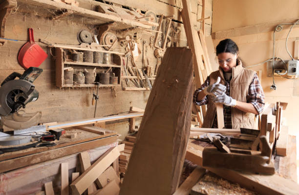istock Female manual worker manufacturing frame in carpentry workshop 917734932