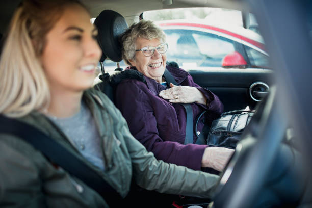in macchina con la nonna - driving senior adult car women foto e immagini stock