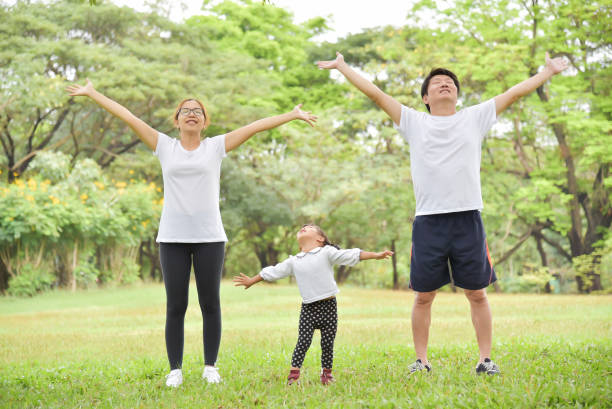 istock Happy Asian family workout at the park. 917735332