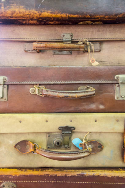 istock Vintage Used Suitcases Stacked Up 917737534