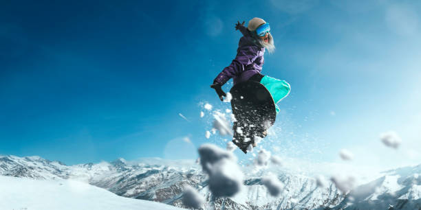 istock Female extreme freestyle snowboarder jump 917737700