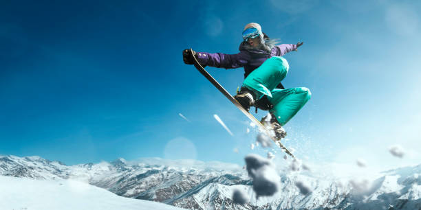 istock Female extreme freestyle snowboarder jump 917737718