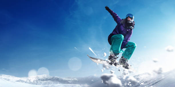 istock Female extreme freestyle snowboarder jump 917737920