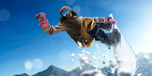 istock Male extreme freestyle snowboarder jump 917737924