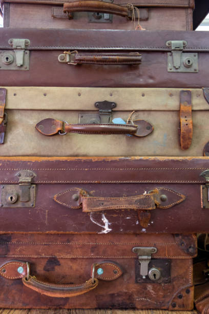 istock Vintage Used Suitcases Stacked Up 917738586