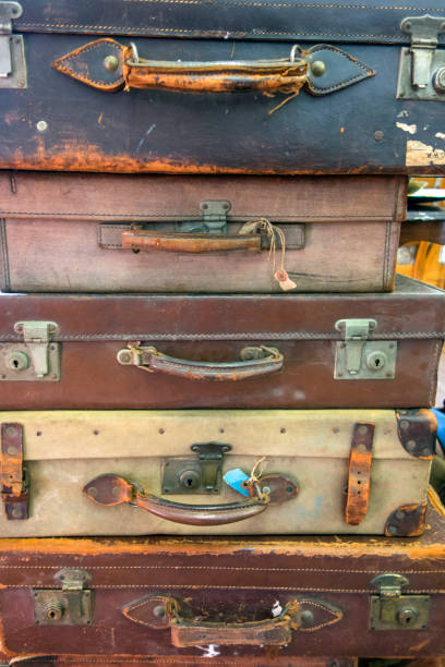 istock Vintage Used Suitcases Stacked Up 917739532
