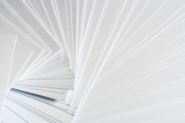 istock White background from stack of clean sheets  paper, laid out randomly in a spiral. 917739824