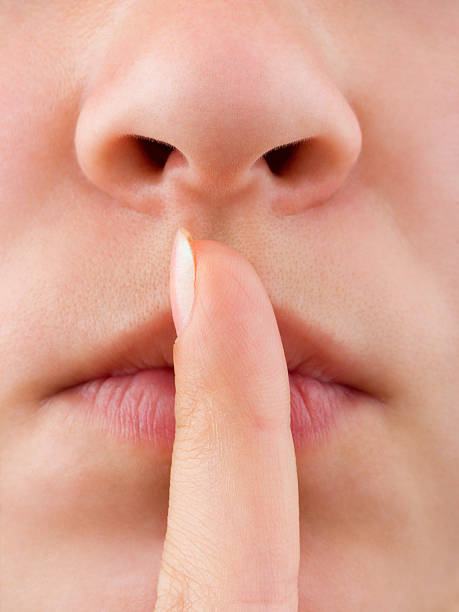 istock Woman holding finger to lip 91774129
