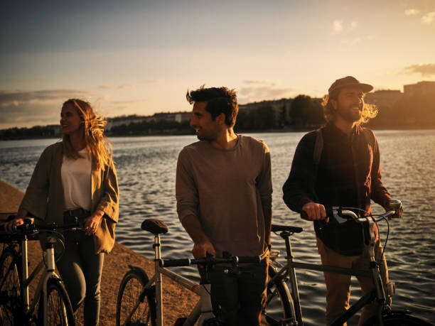Sweet friendships refreshes the soul Shot of friends spending time together outside cycle vehicle photos stock pictures, royalty-free photos & images