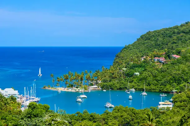 Marigot Bay, Saint Lucia, Caribbean. Tropical bay and beach in exotic and paradise landscape scenery. Marigot Bay is located on the west coast of the Caribbean island of St Lucia. Travel destination for vacation.
