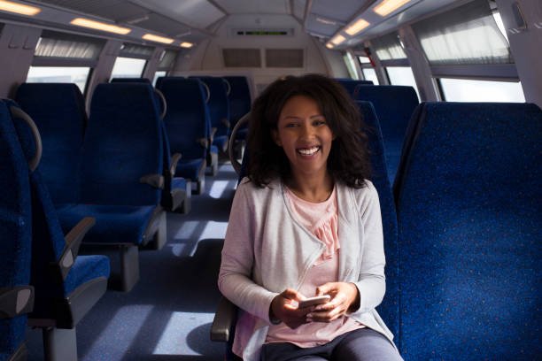 istock A woman texting while traveling on the train. 917744026