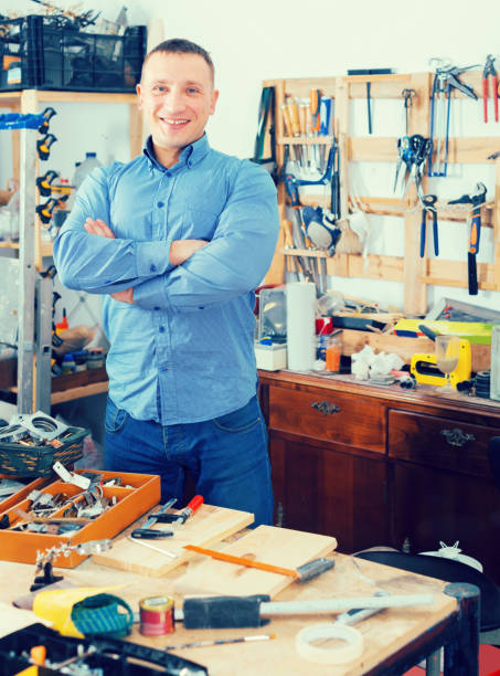 istock Portrait of happy young handsome carpenter  in workshop. 917749694